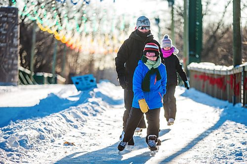 MIKAELA MACKENZIE / WINNIPEG FREE PRESS

Owen Thorvaldson (10, front) leads his dad and sister, Darryl and Mia (13) Thorvaldson, along the skating path at The Forks in Winnipeg on Thursday, Dec. 24, 2020. The canopy rink and some of the trails at The Forks opened yesterday. Standup.

Winnipeg Free Press 2020