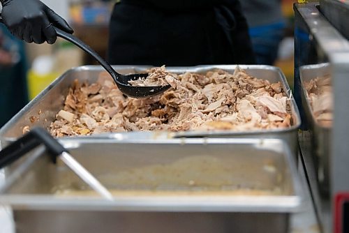 JESSE BOILY  / WINNIPEG FREE PRESS
Annie Hollander prepares the turkey dinners into take out containers on Christmas morning at Agape Table on Friday. Friday, Dec. 25, 2020.
Reporter: Malak Abas