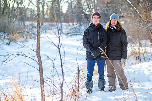 MIKAELA MACKENZIE / WINNIPEG FREE PRESS

Niki Card and her son, Nolan Card (14), pose for a portrait on the bank of the Seine River close to where Nolan fell through the ice (just south of John Bruce Park) in Winnipeg on Monday, Dec. 28, 2020. For Rosanna story.

Winnipeg Free Press 2020