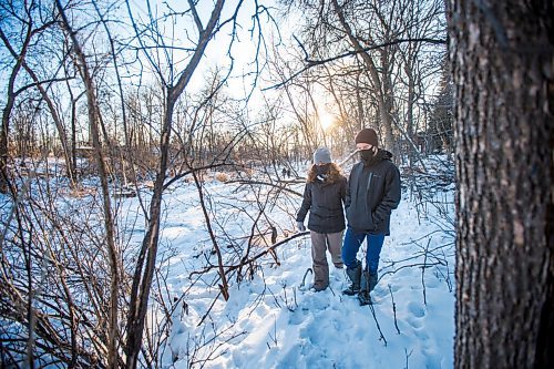 MIKAELA MACKENZIE / WINNIPEG FREE PRESS

Niki Card and her son, Nolan Card (14), take a look at the spot Nolan fell through the ice from the safety of the bank of the Seine River in Winnipeg on Monday, Dec. 28, 2020. For Rosanna story.

Winnipeg Free Press 2020