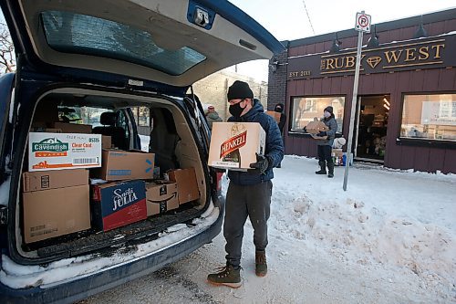 JOHN WOODS / WINNIPEG FREE PRESS
David Boning packs boxes of food into his van outside The Ruby West restaurant on Westminster to deliver to the Bear Clan Monday, December 28, 2020. A group of Wolseley residents gathered food for the Bear Clan.

Reporter: Rutgers
