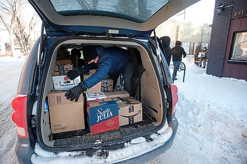 JOHN WOODS / WINNIPEG FREE PRESS
David Boning packs boxes of food into his van outside The Ruby West restaurant on Westminster to deliver to the Bear Clan Monday, December 28, 2020. A group of Wolseley residents gathered food for the Bear Clan.

Reporter: Rutgers