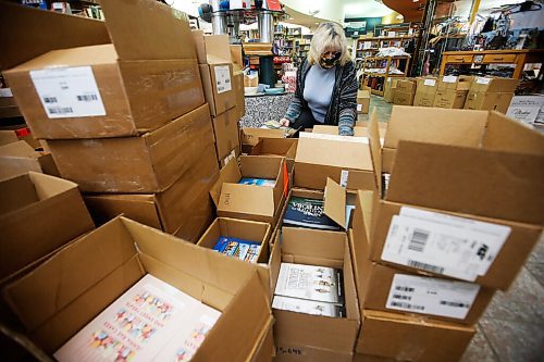 JOHN WOODS / WINNIPEG FREE PRESS
Lori Baker, co-owner of McNally Robinson Booksellers, is photographed amid boxes with their pandemic selling system in an empty store in  Winnipeg Wednesday, December 30, 2020. 

Reporter: Rollason