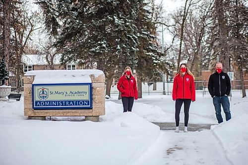 MIKAELA MACKENZIE / WINNIPEG FREE PRESS

Jessica Haner (left), Ashley Keller, and coach Larry Bumstead pose for a photo in front of St Marys Academy in Winnipeg on Thursday, Dec. 31, 2020. For Jason Bell story.

Winnipeg Free Press 2020