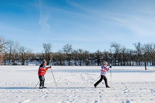 Daniel Crump / Winnipeg Free Press. Bodo Roloff left) and Anne Marie Roloff (right) enjoy an afternoon on the classic cross country ski track at Churchill Drive Park on a mild Saturday afternoon. January 2, 2021.