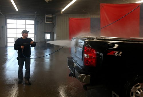 Brandon Sun 16012010 Alex Burr of Rapid City washes his truck at the Giant Car/Truck Wash on Parker Blvd. in Brandon on a beautiful Saturday afternoon. (Tim Smith/Brandon Sun)