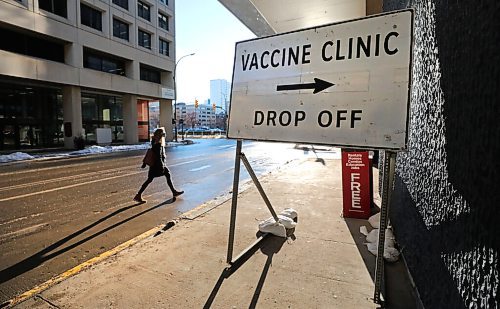 RUTH BONNEVILLE / WINNIPEG FREE PRESS

Local. COVID Vaccinations

Healthcare worker, Andrea Wilkie-Gilmore, makes her way to the entrance of the Convention Centre doors to get her vaccine on Monday.
See Ryan Thorpe story. 

Jan 04,. 2021