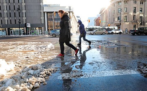 RUTH BONNEVILLE / WINNIPEG FREE PRESS

Local - Street work

Pedestrians make their way over wet and messy streets along Portage Ave. Monday.

For story on wet, messy streets with snow banks.

Jan 04,. 2021
