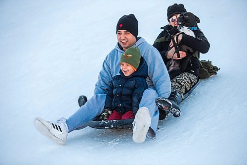 MIKAELA MACKENZIE / WINNIPEG FREE PRESS

Jaxx Kerfoot, three, toboggans with his parents, Norman Beauchamp and Julie Kerfoot, and dog, Kodi, at The Forks in Winnipeg on Monday, Jan. 4, 2021. Standup.

Winnipeg Free Press 2020