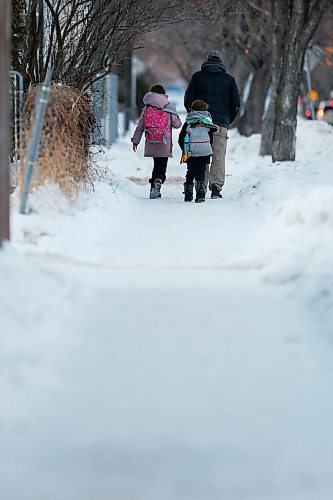 JOHN WOODS / WINNIPEG FREE PRESS
People walk down a sidewalk in Lord Roberts area of Winnipeg Monday, January 4, 2021. Apparently a person has complained about the condition of sidewalks during this warm weather. 

Reporter: ?