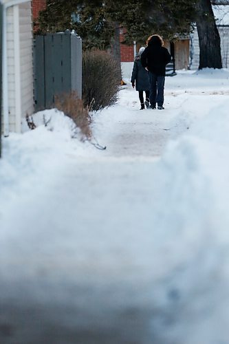 JOHN WOODS / WINNIPEG FREE PRESS
People walk down a sidewalk in Lord Roberts area of Winnipeg Monday, January 4, 2021. Apparently a person has complained about the condition of sidewalks during this warm weather. 

Reporter: ?