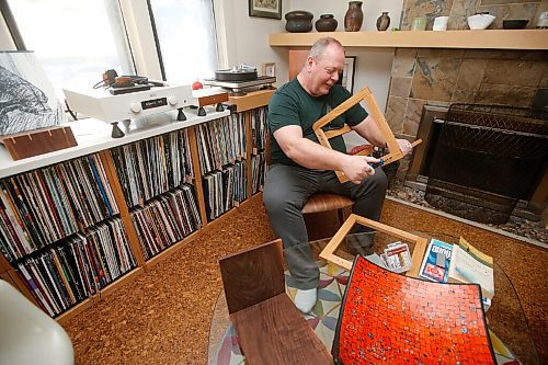 JOHN WOODS / WINNIPEG FREE PRESS
Ian Park, owner of 33 Racket, is photographed with his record storage racks at his home in Winnipeg Monday, January 4, 2021. 

Reporter: sanderson