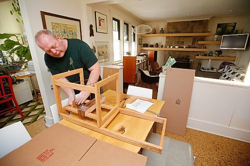 JOHN WOODS / WINNIPEG FREE PRESS
Ian Park, owner of 33 Racket, is photographed with his record storage racks at his home in Winnipeg Monday, January 4, 2021. 

Reporter: sanderson