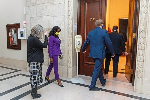 MIKE DEAL / WINNIPEG FREE PRESS
New cabinet minister Audrey Gordon (centre), Minister of Mental Health, Wellness and Recovery, enters the Manitoba Room in the Legislative building to be sworn in by the Lieutenant Governor Janice Filmon and Premier Brian Pallister who announced the his new cabinet, Tuesday morning.
210105 - Tuesday, January 05, 2021.