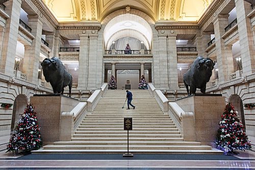 MIKE DEAL / WINNIPEG FREE PRESS
A building maintenance employee sweeps the Grand Staircase on the morning that a new group of cabinet are to be sworn in by the Lieutenant Governor Janice Filmon, Tuesday morning.
210105 - Tuesday, January 05, 2021.