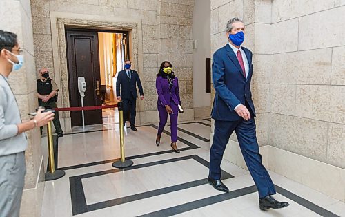 MIKE DEAL / WINNIPEG FREE PRESS
New cabinet ministers Audrey Gordon, Minister of Mental Health, Wellness and Recovery, and Derek Johnson, Minister of Municipal Relations, follow Premier Brian Pallister after being sworn in Tuesday morning.
210105 - Tuesday, January 05, 2021.