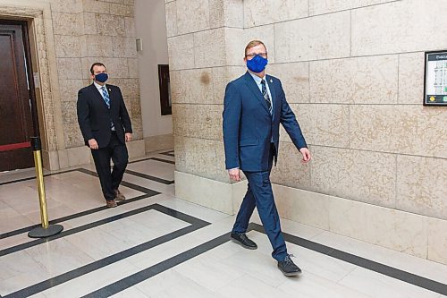 MIKE DEAL / WINNIPEG FREE PRESS
New cabinet ministers Derek Johnson, Minister of Municipal Relations, and Wayne Ewasko, Minister of Advanced Education, Skills and Immigration, follow Premier Brian Pallister after being sworn in Tuesday morning.
210105 - Tuesday, January 05, 2021.