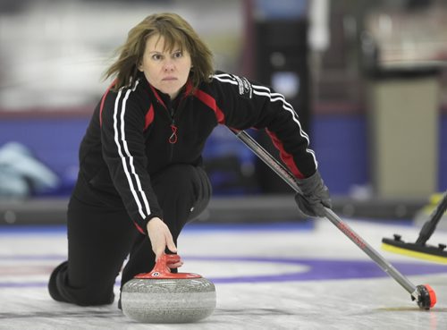 Brandon Sun 17012010 Skip Deb Collyer throws a rock during her rinks A-final match against Lois Fowler's rink in the 74th Annual Brandon Ladies Bonspiel at the Brandon Curling Club on Sunday afternoon. (Tim Smith/Brandon Sun)