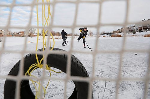 RUTH BONNEVILLE / WINNIPEG FREE PRESS

Local - Retention Ponds, skating

Two 14-year-old boys practice taking shots at the net on a retention pond that has been cleared off to skate on in South St. Vital Tuesday.

See story retention ponds debate with Coun. Lukes.  Joyanne 

Jan 06,. 2021