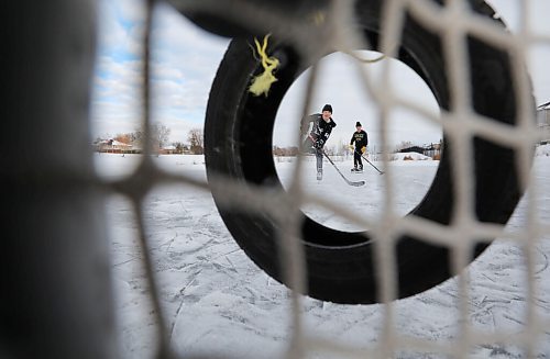 RUTH BONNEVILLE / WINNIPEG FREE PRESS

Local - Retention Ponds, skating

Two 14-year-old boys practice taking shots at the net on a retention pond that has been cleared off to skate on in South St. Vital Tuesday.

See story retention ponds debate with Coun. Lukes.  Joyanne 

Jan 06,. 2021