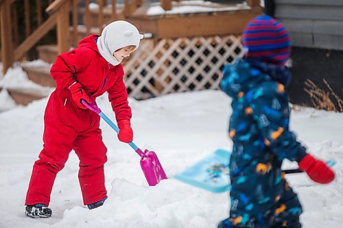 MIKAELA MACKENZIE / WINNIPEG FREE PRESS

Ruth Pawlyk, six (left), and her younger brother, William Pawlyk, four, help their dad shovel snow in the West End in Winnipeg on Thursday, Jan. 7, 2021. Standup.

Winnipeg Free Press 2020