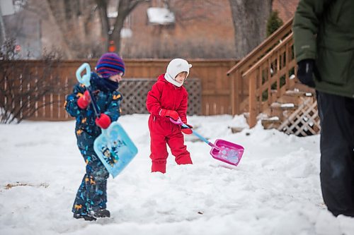 MIKAELA MACKENZIE / WINNIPEG FREE PRESS

Ruth Pawlyk, six (centre), and her younger brother, William Pawlyk, four, help their dad shovel snow as he levels an area for a rink in their front yard in the West End in Winnipeg on Thursday, Jan. 7, 2021. Standup.

Winnipeg Free Press 2020