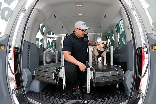 JOHN WOODS / WINNIPEG FREE PRESS
Tito Urbina, co-owner of Dog Dash - Mobile Dog Gym, is photographed with Luna in the mobile dog treadmill gym in Winnipeg Thursday, January 7, 2021. 

Reporter: Sanderson