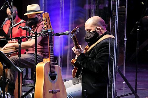 Daniel Crump / Winnipeg Free Press. Guitarist Rodrigo Muñoz wears a special singers mask that allows him to perform while adhering to public health orders. The Winnipeg Symphony Orchestra performs a livestream event with Winnipeg based trio Papa Mambo at the Centennial Concert Hall. January 9, 2020.