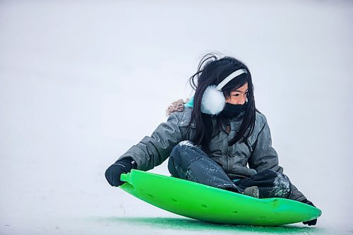 MIKAELA MACKENZIE / WINNIPEG FREE PRESS

Margaux Banzil, seven, toboggans at Westview Park in Winnipeg on Monday, Jan. 11, 2021. Standup.

Winnipeg Free Press 2020