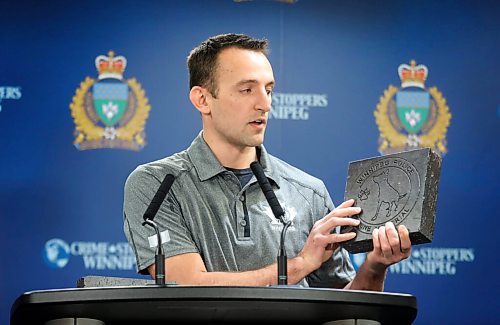 RUTH BONNEVILLE / WINNIPEG FREE PRESS

Local - Canine memorial stones

Presser: Canine Memorial Fundraising Campaign.

Const. Justin Casavant, holds a memorial stone that can be purchased by the public as part of their newly launched Canine Memorial Fundraising Campaign, Wednesday.

Jan 13,. 2021