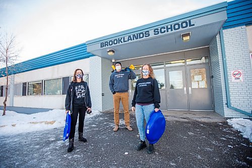 MIKAELA MACKENZIE / WINNIPEG FREE PRESS

Joelle Suzuki (left), Rex Ferguson-Baird, and Shannon Siemens pose for a portrait with saucer sleds and shovels at Brooklands School in Winnipeg on Wednesday, Jan. 13, 2021. Manitoba Eco-Network recently gave Brooklands School staff an award in recognition of their various environmental initiatives, which include holding all classes outdoors for the last six weeks of each school year (rain or shine) as a way to teach students how to appreciate nature. For Aaron Epp story.

Winnipeg Free Press 2021