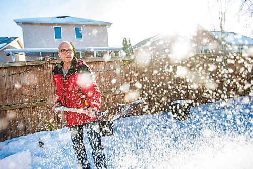 MIKAELA MACKENZIE / WINNIPEG FREE PRESS

Gordon Giesbrecht, a former wilderness instructor, and a professor of cold physiology, demonstrates throwing the snow in the air as a quinzee making technique in his back yard in Winnipeg on Wednesday, Jan. 13, 2021.  For Ben Waldman story.

Winnipeg Free Press 2021