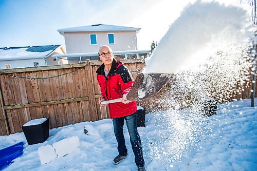 MIKAELA MACKENZIE / WINNIPEG FREE PRESS

Gordon Giesbrecht, a former wilderness instructor, and a professor of cold physiology, demonstrates throwing the snow in the air as a quinzee making technique in his back yard in Winnipeg on Wednesday, Jan. 13, 2021.  For Ben Waldman story.

Winnipeg Free Press 2021