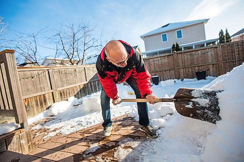 MIKAELA MACKENZIE / WINNIPEG FREE PRESS

Gordon Giesbrecht, a former wilderness instructor, and a professor of cold physiology, demonstrates how to dig the entrance out of a quinzee in his back yard in Winnipeg on Wednesday, Jan. 13, 2021.  For Ben Waldman story.

Winnipeg Free Press 2021