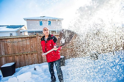 MIKAELA MACKENZIE / WINNIPEG FREE PRESS

Gordon Giesbrecht, a former wilderness instructor, and a professor of cold physiology, demonstrates throwing the snow in the air as a quinzee making technique in his back yard in Winnipeg on Wednesday, Jan. 13, 2021.  For Ben Waldman story.

Winnipeg Free Press 2021