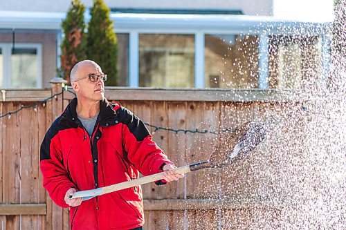 MIKAELA MACKENZIE / WINNIPEG FREE PRESS

Gordon Giesbrecht, a former wilderness instructor, and a professor of cold physiology, demonstrates throwing the snow in the air as a quinzee making technique in his back yard in Winnipeg on Wednesday, Jan. 13, 2021.  For Ben Waldman story.

Winnipeg Free Press 2021