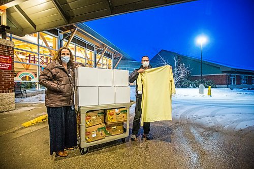 MIKAELA MACKENZIE / WINNIPEG FREE PRESS

Cindy Greenlay, manager of support services (left), and Ian Kleinsasser, member of Crystal Springs Hutterite Colony, pose with boxes of isolation gowns at the Simkin Centre in Winnipeg on Thursday, Jan. 14, 2021.  Hutterite colonies sewed the isolation gowns for the Jewish personal care home, repaying a kindness shows decades ago when Jewish business people stood up for Hutterites to buy land in Manitoba. For Brenda Suderman story.

Winnipeg Free Press 2021