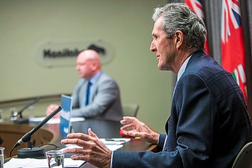 MIKAELA MACKENZIE / WINNIPEG FREE PRESS

Premier Brian Pallister (front) and Dr. Brent Roussin, chief provincial public health officer, speak at a press conference at the Manitoba Legislative Building in Winnipeg on Friday, Jan. 15, 2021.  For Carol Sanders story.

Winnipeg Free Press 2021