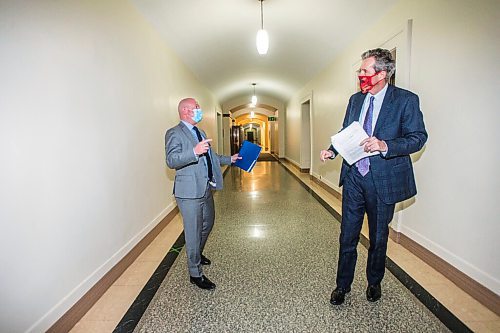 MIKAELA MACKENZIE / WINNIPEG FREE PRESS

Dr. Brent Roussin, chief provincial public health officer (left), and Premier Brian Pallister talk to each other in the hallway after a press conference at the Manitoba Legislative Building in Winnipeg on Friday, Jan. 15, 2021.  For Carol Sanders story.

Winnipeg Free Press 2021