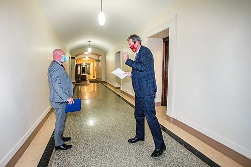 MIKAELA MACKENZIE / WINNIPEG FREE PRESS

Dr. Brent Roussin, chief provincial public health officer (left), and Premier Brian Pallister talk to each other in the hallway after a press conference at the Manitoba Legislative Building in Winnipeg on Friday, Jan. 15, 2021.  For Carol Sanders story.

Winnipeg Free Press 2021