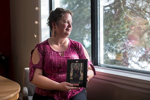 MIKAELA MACKENZIE / WINNIPEG FREE PRESS

Gloria Froese, former Church of God member, poses for a portrait with her graduation photo (from the time when she was with the church) at her home in Winnipeg on Friday, Jan. 15, 2021.  For Kevin story.

Winnipeg Free Press 2021