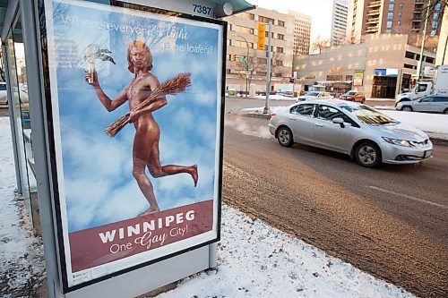 MIKE DEAL / WINNIPEG FREE PRESS
A bus shelter at Donald and Broadway with the One Gay City poster.
Lorri Millan and Shawna Dempsey set out more than two decades ago to depict Winnipeg as a safe haven for the LGBTQ community through a mock advertising campaign. It never saw the light of day then. 23 years later, their art work, posters heralding Winnipeg as "One Gay City", has been displayed on three bus shelters in the downtown, as part of a new art project from the University of Manitoba School of Art Gallery.
210115 - Friday, January 15, 2021.