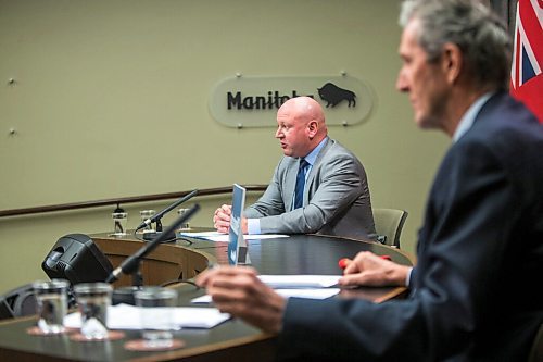 MIKAELA MACKENZIE / WINNIPEG FREE PRESS

Dr. Brent Roussin, chief provincial public health officer (left), and Premier Brian Pallister speak at a press conference at the Manitoba Legislative Building in Winnipeg on Friday, Jan. 15, 2021.  For Carol Sanders story.

Winnipeg Free Press 2021