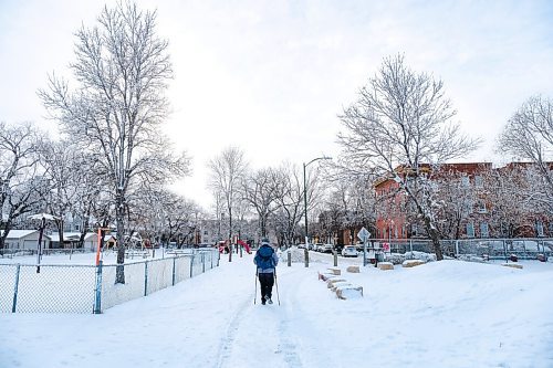 Daniel Crump / Winnipeg Free Press. A Person walks on a footpath near the West Broadway Community Centre Saturday morning. January 16, 2021.