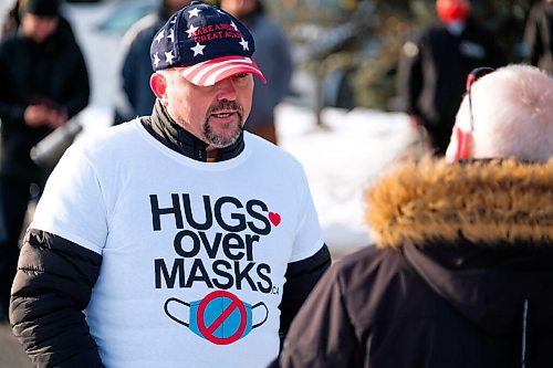 Daniel Crump / Winnipeg Free Press. A protestor (left) and counter protestor (right) debate during the Hugs Over Masks protest in Steinbach, Manitoba. January 16, 2021.