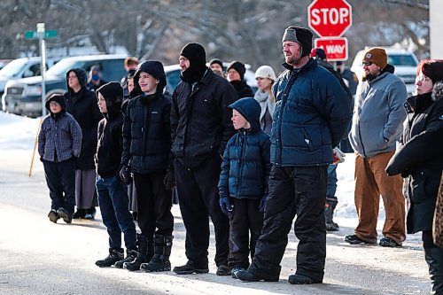 Daniel Crump / Winnipeg Free Press. People listen to a speaker during an anti-mask protest held by the group Hugs Over Masks outside city hall in Steinbach, Manitoba. January 16, 2021.