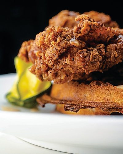 Canstar Community News One Great City Brewing Co.'s Fried Chicken Fest offering is twice-fried buttermilk chicken with a cheddar chive waffle, pickled zucchini, white BBQ sauce and spiced honey.