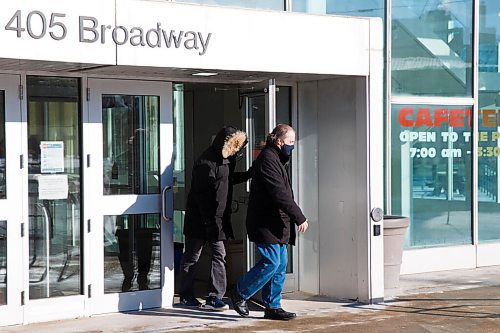 MIKE DEAL / WINNIPEG FREE PRESS
Greg Fenske, right, a former Peter Nygard executive, and Steve Mager leave the Law Courts complex during a break for lunch. Both men are testifying on Nygard's behalf during his bail hearing.
210119 - Tuesday, January 19, 2021.
