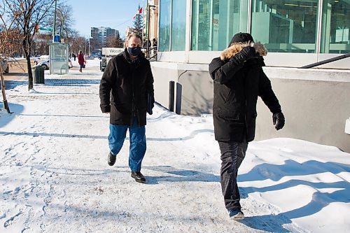 MIKE DEAL / WINNIPEG FREE PRESS
Greg Fenske, left, a former Peter Nygard executive, and Steve Mager leave the Law Courts complex during a break for lunch. Both men are testifying on Nygard's behalf during his bail hearing.
210119 - Tuesday, January 19, 2021.