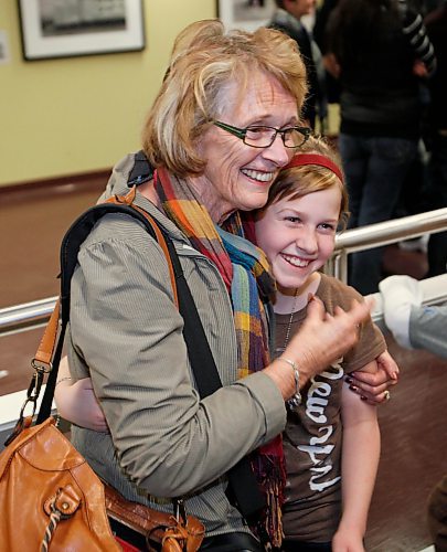 BORIS.MINKEVICH@FREEPRESS.MB.CA BORIS MINKEVICH/ WINNIPEG FREE PRESS  100121 Wilma Barkman gets a hug from a family member at the airport.